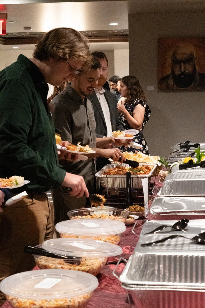 John's South Indian Kitchen buffet line guests serving