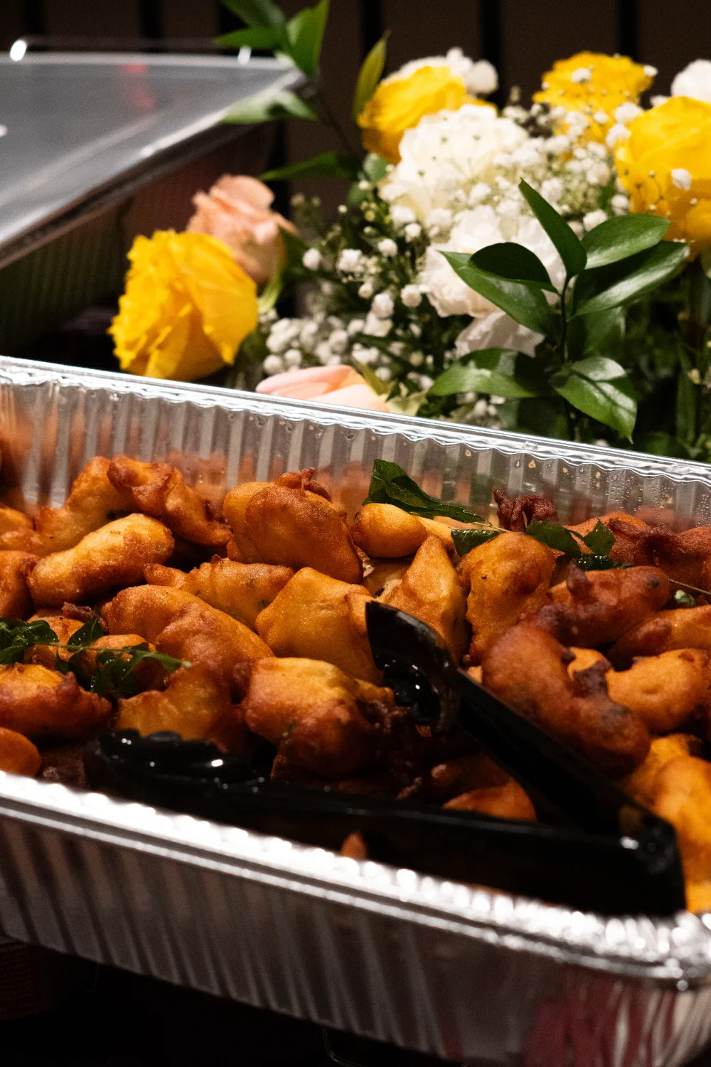 John's South Indian Kitchen golden fritters tray yellow rose garnish